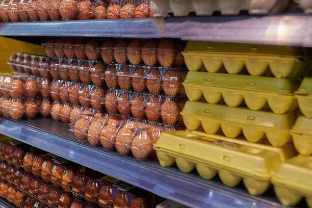 Showcase chicken eggs in the store stock photo