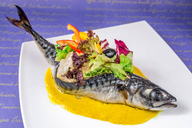 istock Sea fish, dressed with vegetables and olives 1041414554