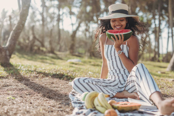 istock Woman eating a watermelon 1041439994