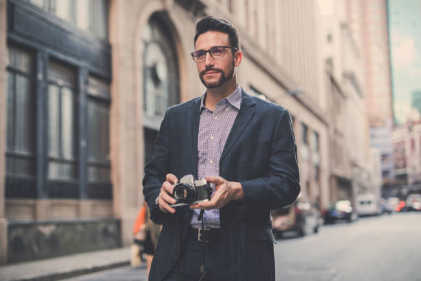 istock Photographer on the street 1041440024