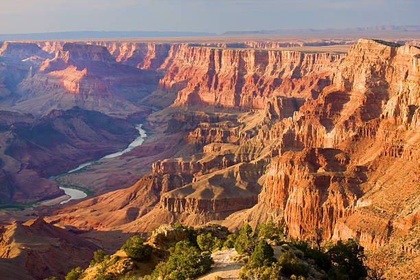 Grand Canyon landscape at dusk viewed from desert Beautiful Landscape of Grand Canyon from Desert View Point with the Colorado River visible during dusk eroded photos stock pictures, royalty-free photos & images