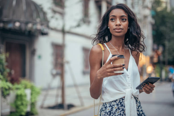 istock Beautiful woman with coffee cup 1041445356