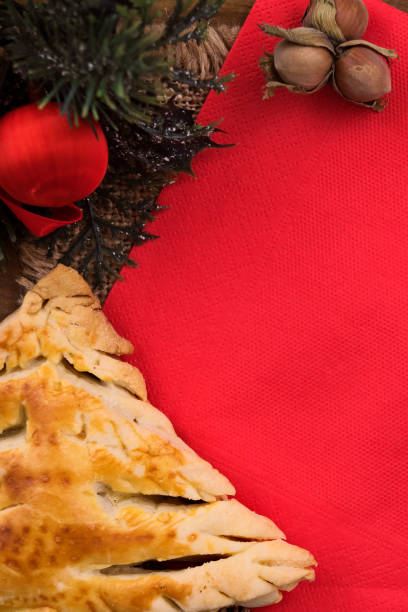 istock Christmas tree of sand dough on a red napkin, vertical frame, copy space. 1041447024