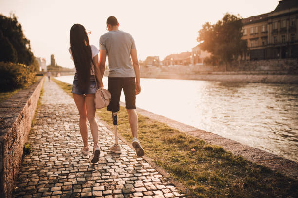 istock Young couple walking in sunset 1041456048