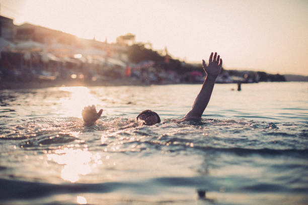 istock Man drowning in the water 1041464414