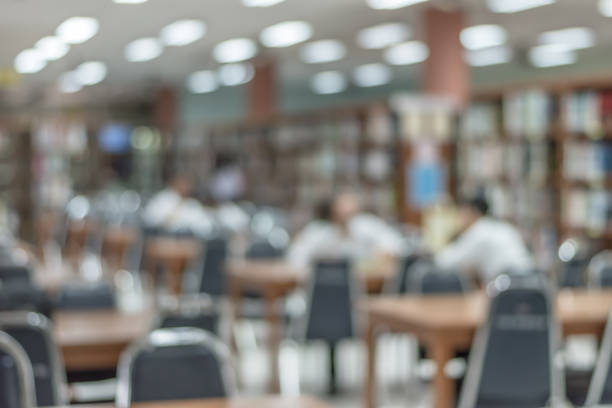 istock Blur school library or study room with book shelves and seats for education background 1041469242