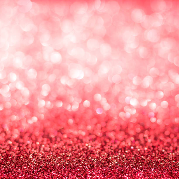 istock Red blur glitter Christmas and Valentine's day bokeh background with blurry silver white sparkling light of metallic glitz texture shimmering backdrop for holiday decoration 1041469348