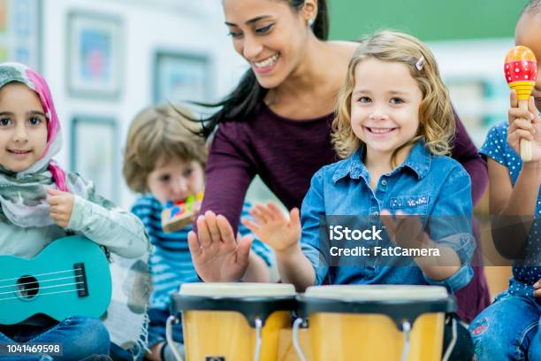 Having Fun Playing The Hand Drums In Elementary School Stock Photo - Download Image Now