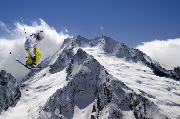 istock Freestyle ski jumper with crossed skis 1041472810