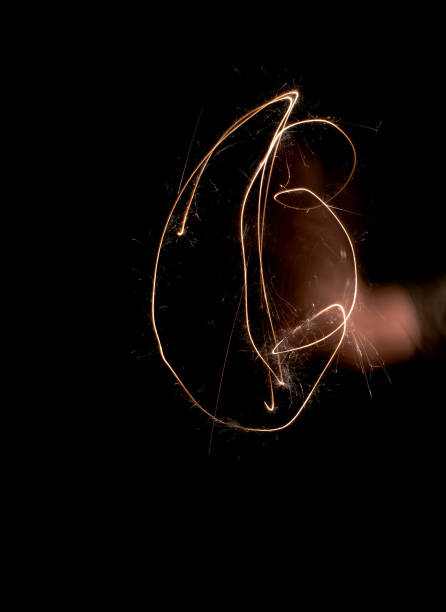 istock light painting and blurred hand on black 1041473078