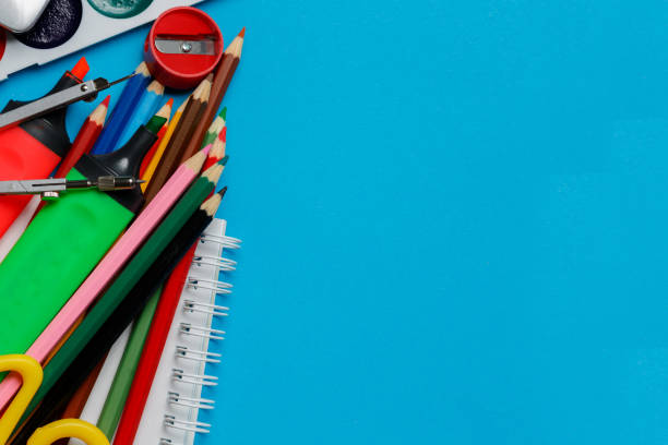 istock School office supplies on blue background 1041473154