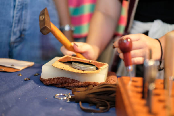 istock craftsman making leather bag. handmade DIY handicraft 1041473762