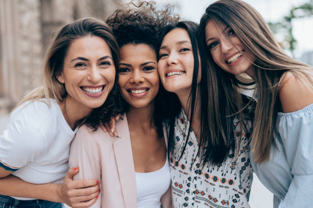 Portrait of four best girlfriends Portrait of four best girlfriends smiling together cheek to cheek photos stock pictures, royalty-free photos & images