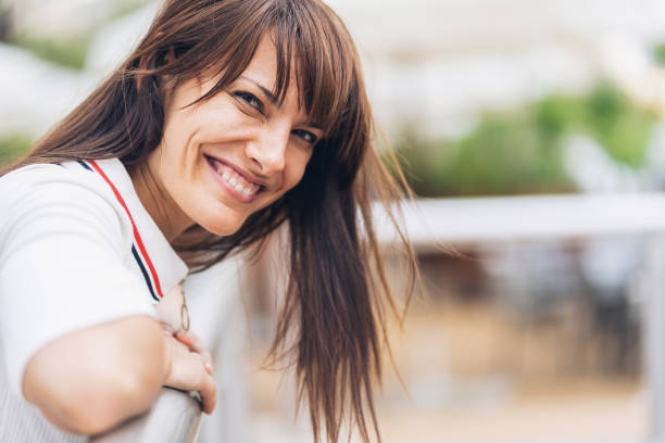 istock Woman leaning on railing 1041475544