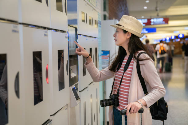 istock visitor browzing intelligent coin lockers. 1041476046