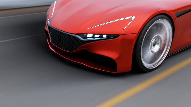 istock red car driving on a road by sea 1041476940