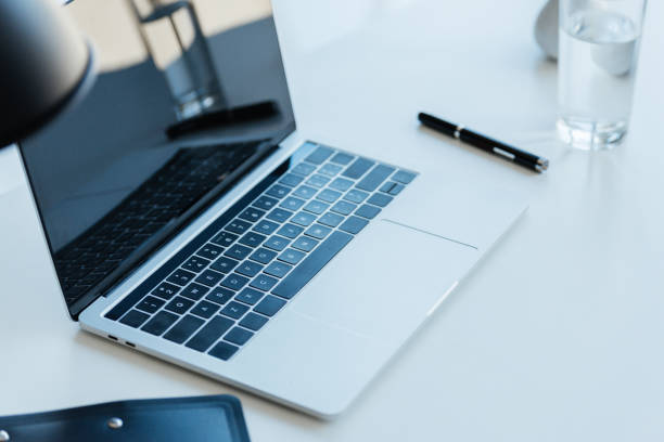 istock selective focus of laptop with blank screen on table in modern office 1041482718