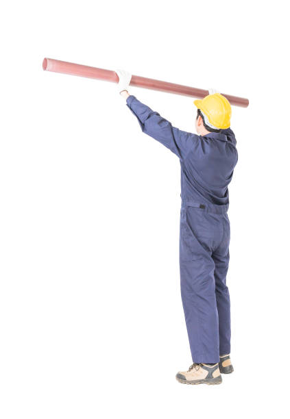 istock Plumber in uniform holding pvc pipe with clipping path 1041483364