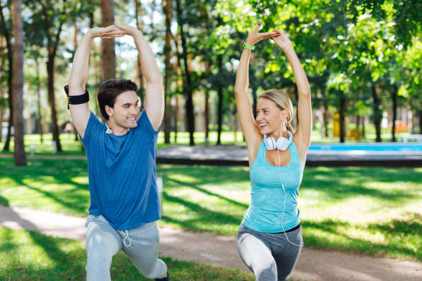 istock Joyful positive couple holding their hands up 1041484434