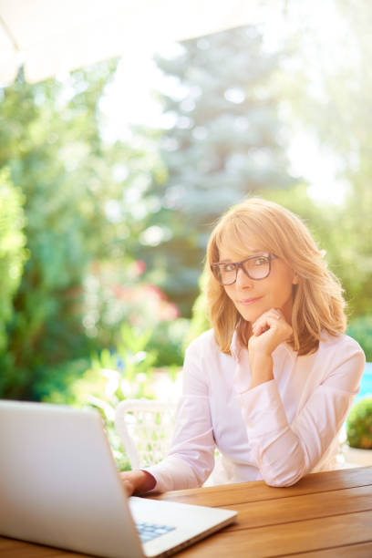 istock Confident woman working online at home 1041484958