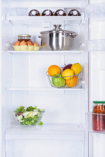 istock ripe fruits, salad, pan and eggs in fridge 1041488286