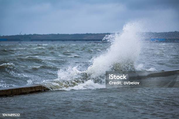 Splash Of A Large Wave On The Flooded Embankment Of The Resort City On The Black Sea Stock Photo - Download Image Now