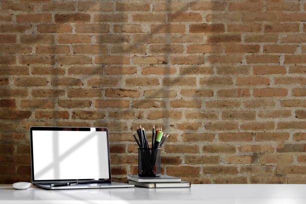 istock Mockup laptop computer and office supplies.  Workspace and copy space. 1041490038