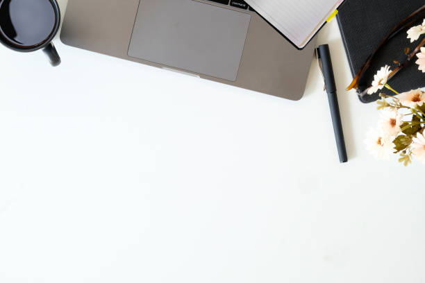 istock Workspace top table with laptop and office supplies. Top view with copy space, flat lay or hero header concept. 1041493068
