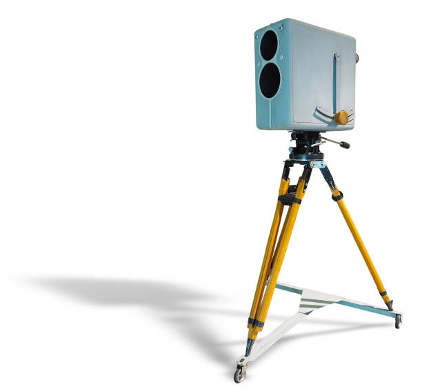 istock Retro ancient TV Professional studio old video camera on tripod isolated on white background 1041495434