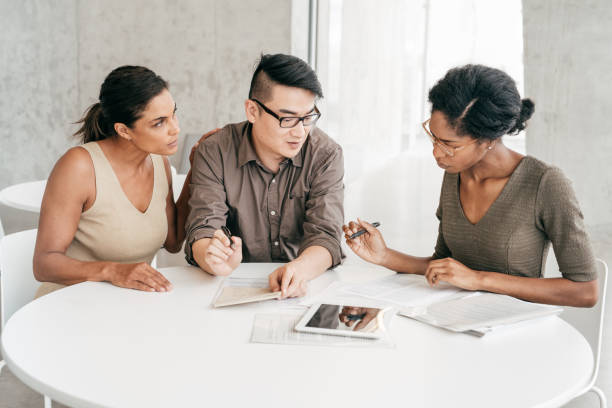 istock Couple meeting with mortgage broker 1041502362