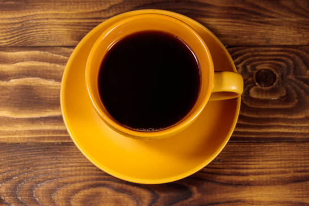 istock Cup of coffee on the wooden table. Top view 1041504584