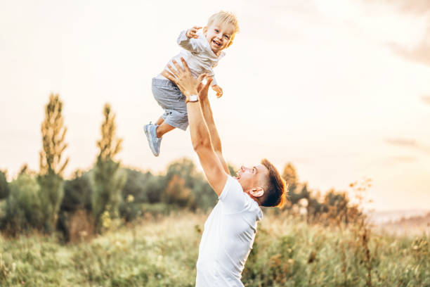 istock Father and his little son have fun outdoor 1041508480