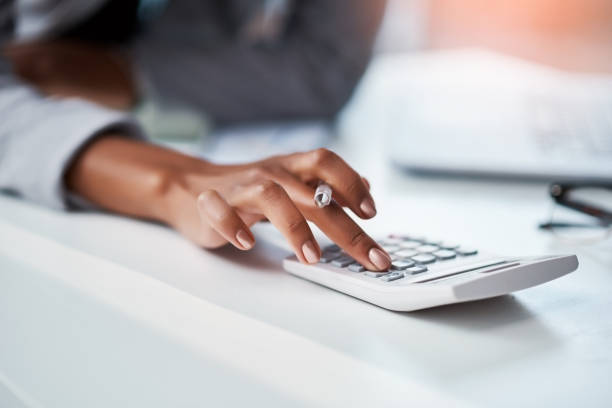 Know your numbers, know your business Cropped shot of a businesswoman using a calculator at her desk in a modern office capital budget pictures stock pictures, royalty-free photos & images
