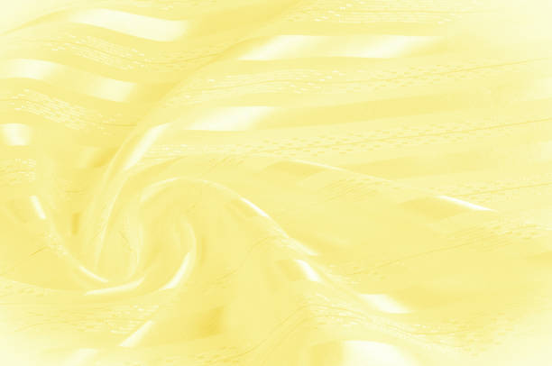 background texture, pattern. yellow silk fabric with a light stripe. yellowish tissue. smooth elegant yellow satin background. - 12007 imagens e fotografias de stock