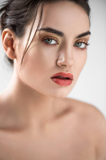istock attractive stylish girl with makeup, isolated on grey 1041514738