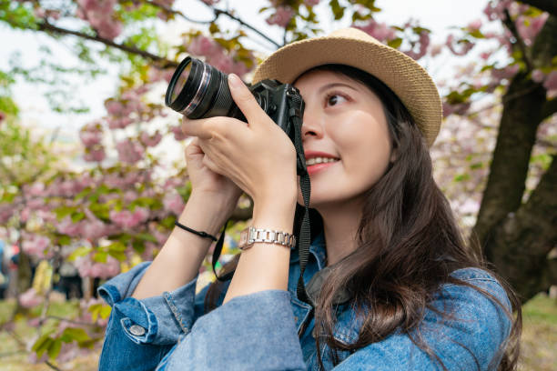 istock asian visitor taking photo and looking happy 1041525766