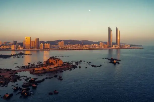 Xiamen skyline aerial view at sunset with urban buildings in Fujian, China.
