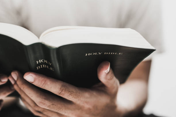 Reading Holy Bible Closeup shot of reading holy bible. church photos stock pictures, royalty-free photos & images