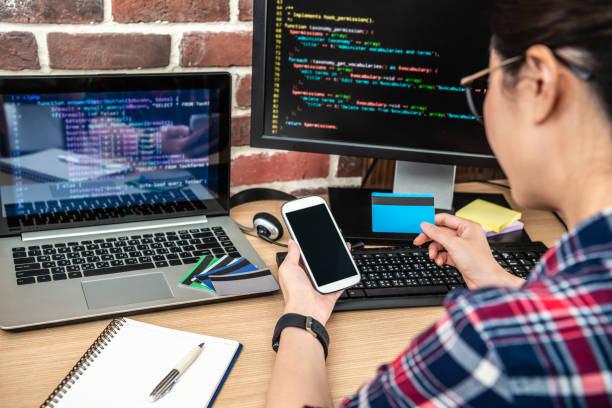 istock back view of using a credit card and smartphone 1041547402