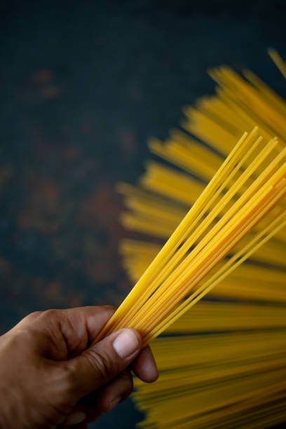 istock Italian food spaghetti on black background 1041548110