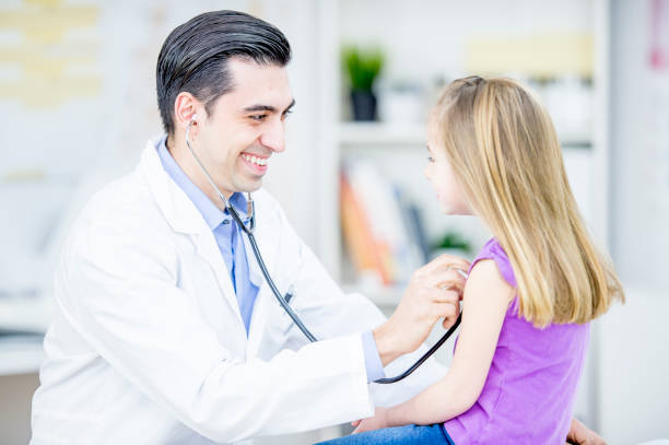 istock Examining Girl's Heartbeat 1041548194