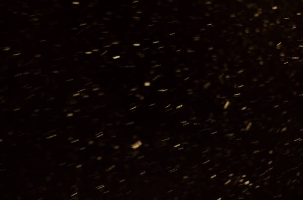 istock Snow falling from the night sky 1041553602