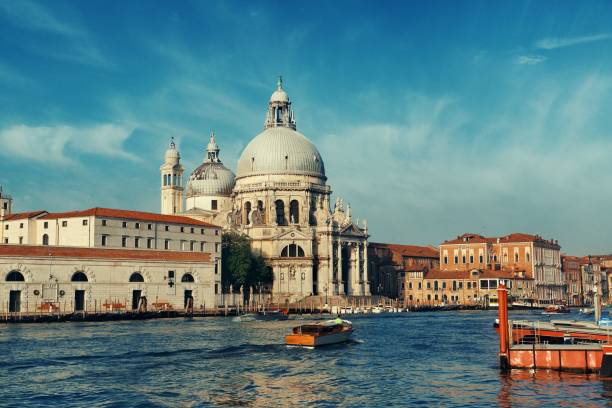 istock Venice Grand Canal sunrise and boat 1041556890