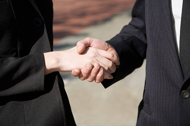 istock Man and woman handshake - close 104156717