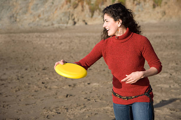 istock Woman throwing frisbee 104156846