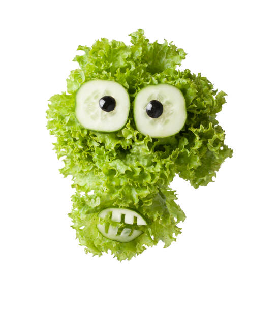 istock Funny ghost made with green salad and cucumber 1041571790