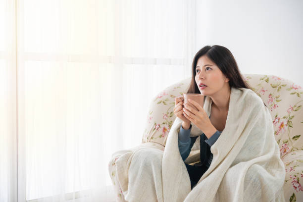 istock female holding a cup of tea and thinking 1041579264
