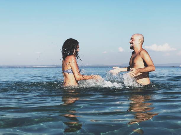 istock Young couple enjoying sea 1041579322