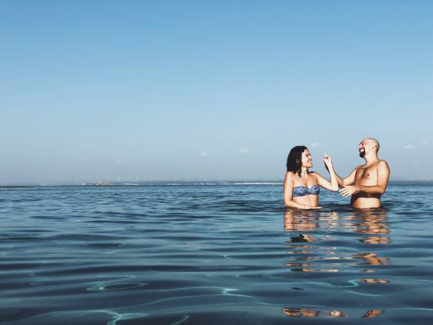 istock Young couple enjoying sea 1041579368