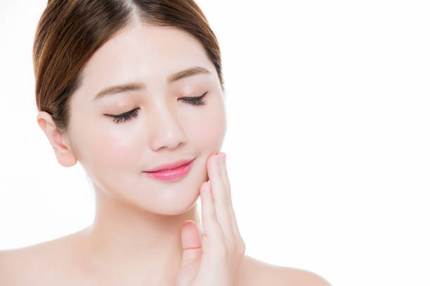 istock beauty woman touch face 1041579702